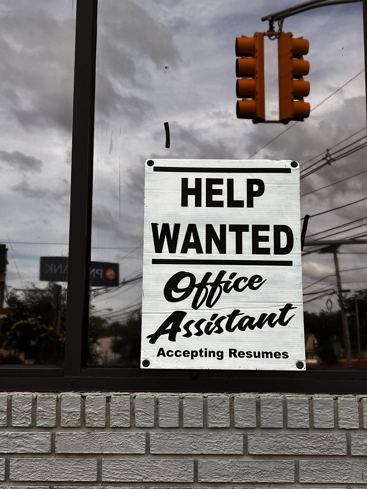 black and white help wanted sign for office assistant perfect for recent grads.